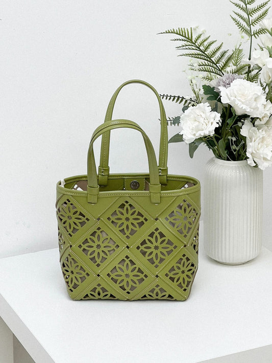 2340 hollowed-out genuine leather handbag