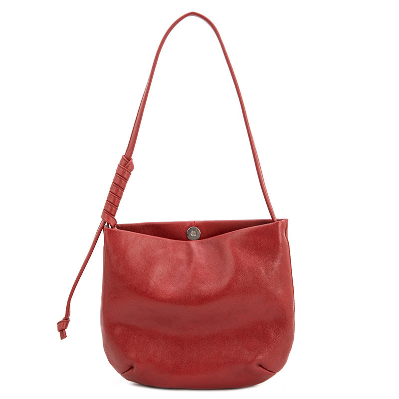 1834 cowhide solid bucket handbag