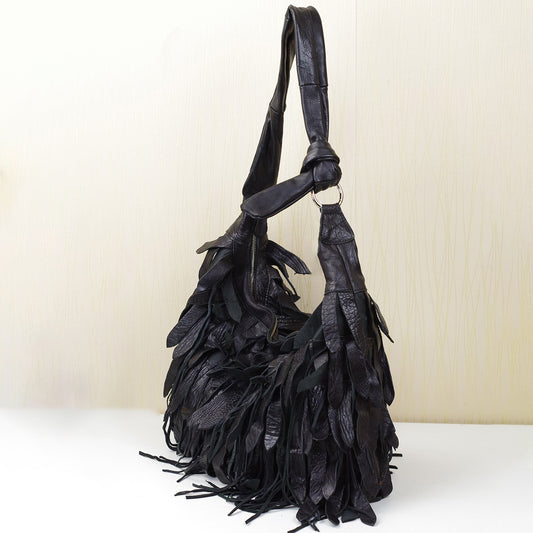 1641 sheepskin tassle hobo bag